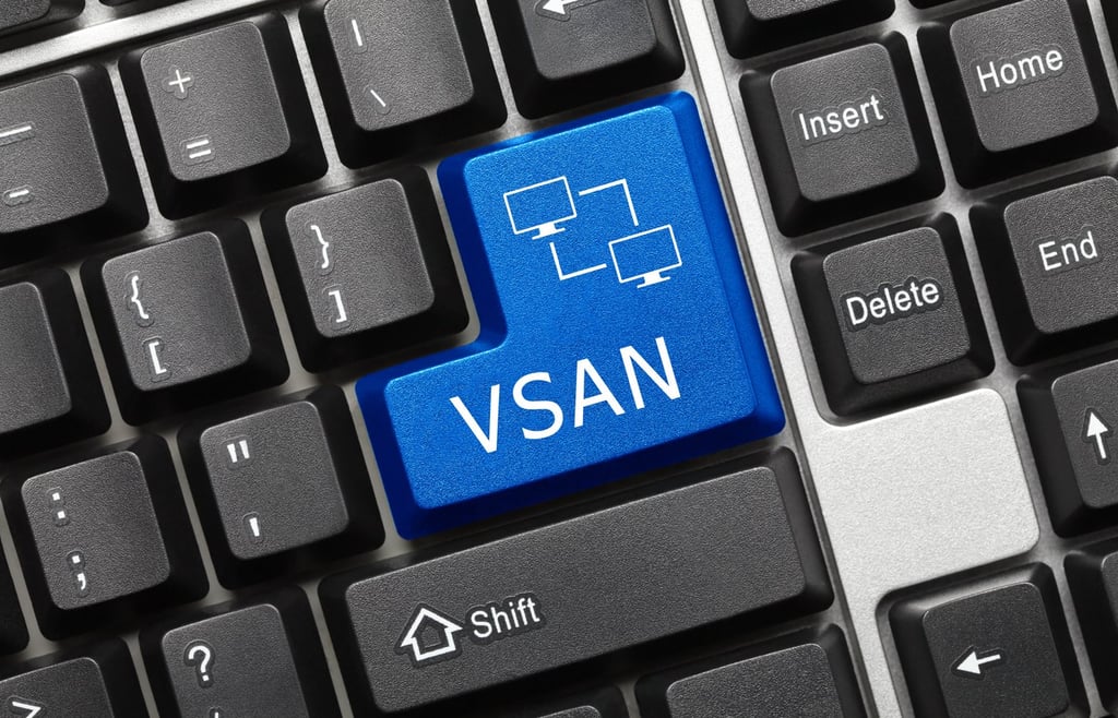 Custom blue key with VSAN inscription on a keyboard.